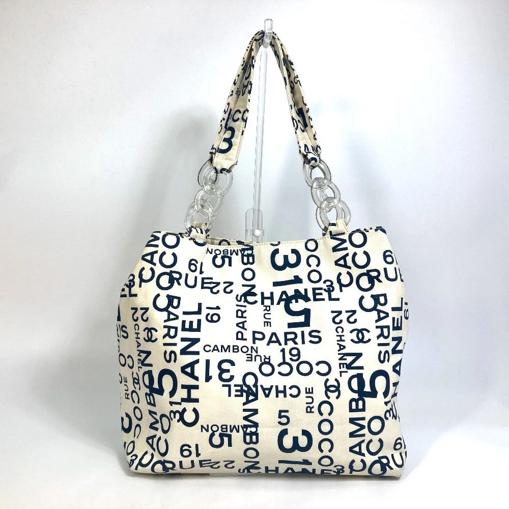 CHANEL BY THE SEA CC MARK CLEAR CHAIN SHOULDER TOTE BAG: CHANEL By the Sea CC Mark Clear Chain Shoulder Tote Bag Brand: CHANEL Type/Style: Tote Bag Material: Canvas Color: White / Navy Size: W12.6xH12.2xD5.8inch / W32cmxH31cmxD14.7cm Accessories: None <