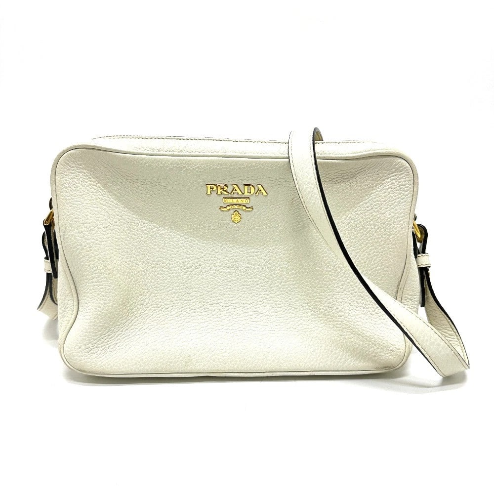 PRADA LOGO DOUBLE ZIPPER BAG SHOULDER BAG: PRADA logo Double zipper bag Shoulder Bag Brand: PRADA Type/Style: Shoulder Bag Material: Leather Color: whitexgold hardware Size: W9.4xH6.3xD3.5inch / W24cmxH16cmxD9cm Accessories: None A