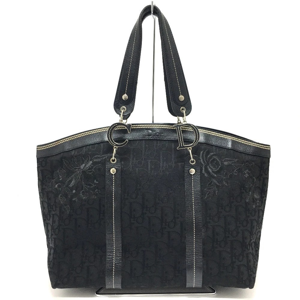 CHRISTIAN DIOR FLOWER EMBROIDERY TROTTER SHOULDER TOTE BAG: CHRISTIAN DIOR Flower Embroidery Trotter Shoulder Tote Bag Brand: Christian Dior Type/Style: Tote Bag Material: Canvas/Leather Color: Black Size: W12.5xH10.6xD5.1inch / W31.7cmxH27cmxD13cm Handle:
