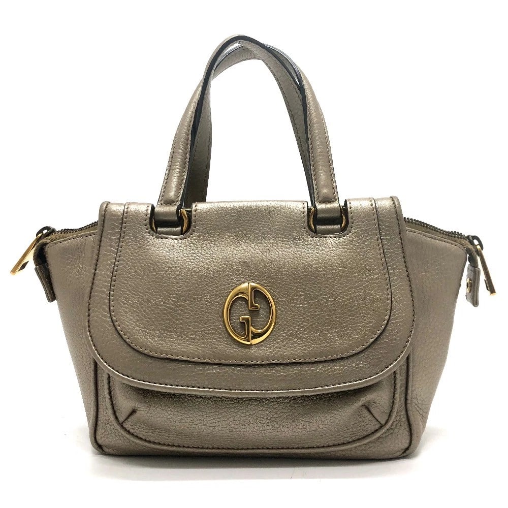GUCCI GG DOUBLE G DETAIL HAND BAG: GUCCI GG Double G Detail Hand Bag Brand: GUCCI Type/Style: Hand Bag Material: Leather Color: Gold / GoldHardware Size: W10.6xH6.3xD3.3inch / W27cmxH16cmxD8.5cm Handle: 11.0inch / 28cm Accessories: