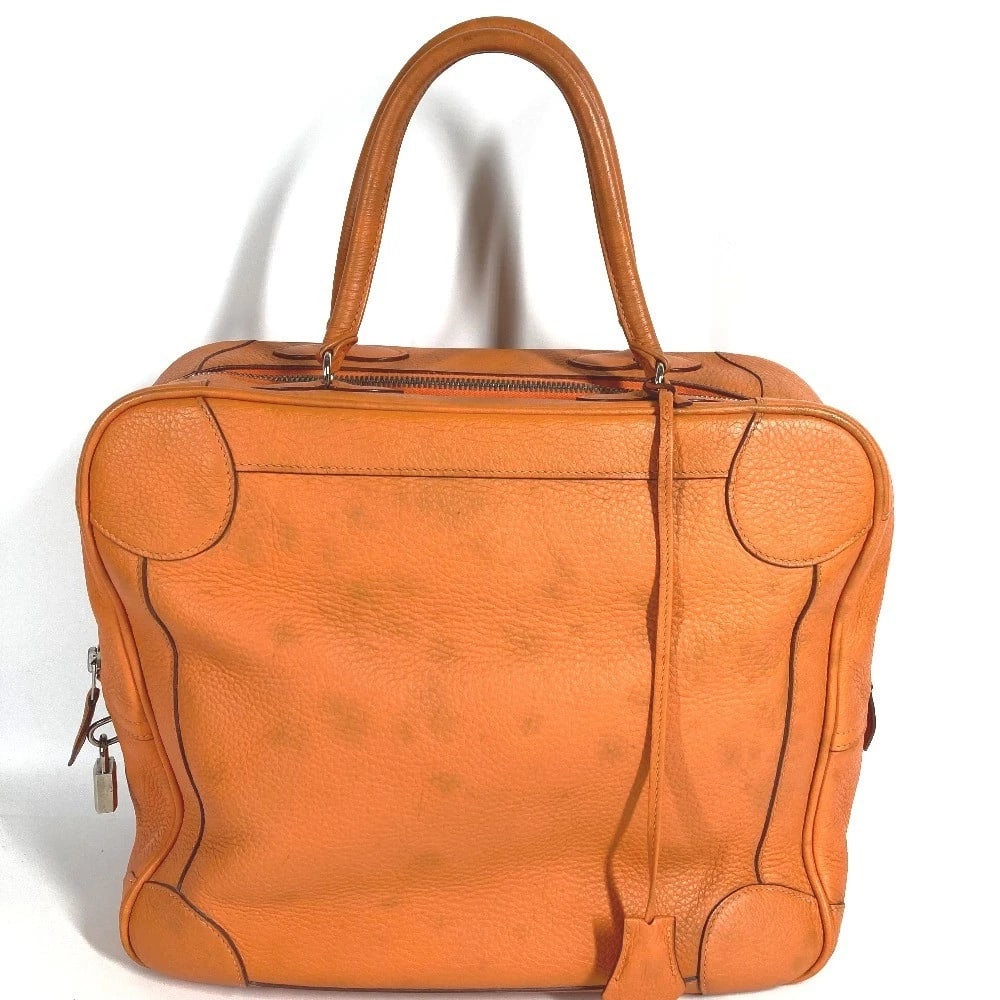 HERMES DUFFLE BAG OMNIBUS MM TOTE BAG: HERMES Duffle Bag Omnibus MM Tote Bag Brand: HERMES Type/Style: Hand Bag Material: Leather Color: Orange/silver Hardware Size: W12.8xH11.0xD4.3inch / W32.5cmxH28cmxD11cm Accessories: None
