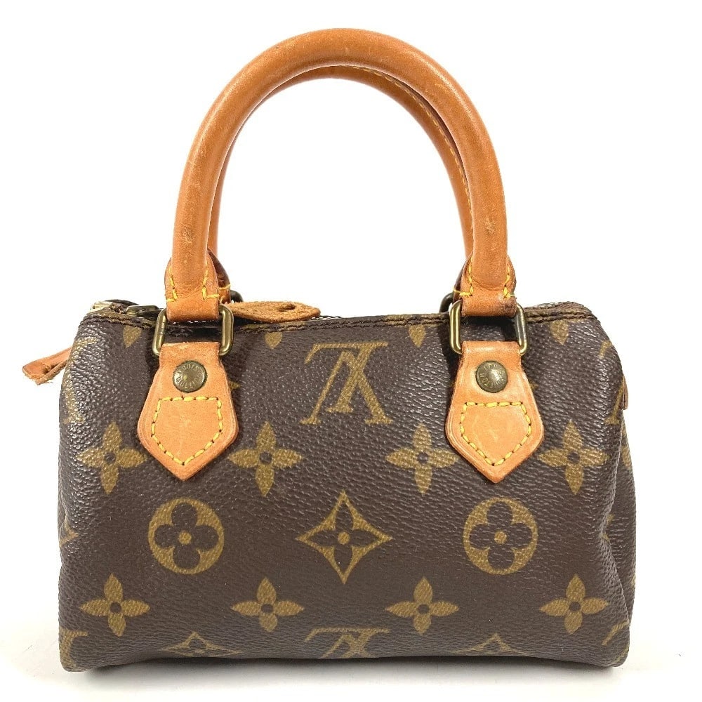 LOUIS VUITTON MONOGRAM MINI SPEEDY POUCH HAND BAG: LOUIS VUITTON Monogram Mini Speedy Pouch Hand Bag Brand: Louis Vuitton Type/Style: Hand Bag Material: Monogram Canvas Color: Brown Size: W6.1xH3.5xD2.6inch / W15.5cmxH9cmxD6.5cm Accessories: None