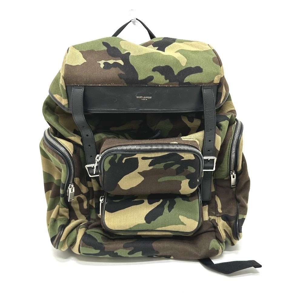 SAINT LAURENT PARIS MULTI-POCKET CAMOUFLAGE BACKPACK: SAINT LAURENT PARIS Multi-pocket camouflage Backpack Brand: SAINT LAURENT PARIS Type/Style: Backpack Material: Canvas/Leather Color: Green Size: W13.8xH15.7xD6.3inch / W35cmxH40cmxD16cm Accessorie