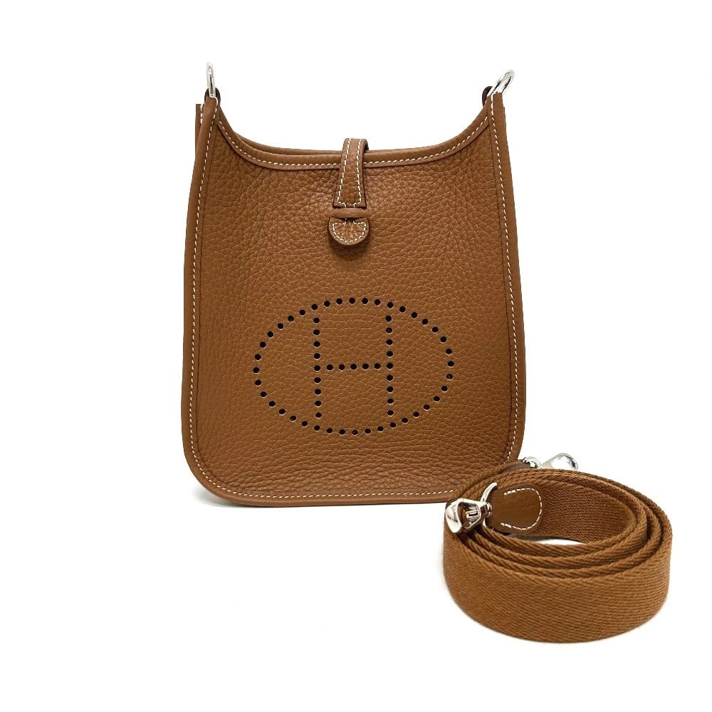 HERMES EVELYNETPM CROSSBODY BAG POCHETTE SHOULDER BAG: HERMES EvelyneTPM Crossbody bag Pochette Shoulder Bag Brand: HERMES Type/Style: Shoulder Bag Material: Taurillon Clece Color: Goldx Metal fittings Silver Size: W7.1xH7.9xD2.0inch / W18cmxH20cmxD5cm