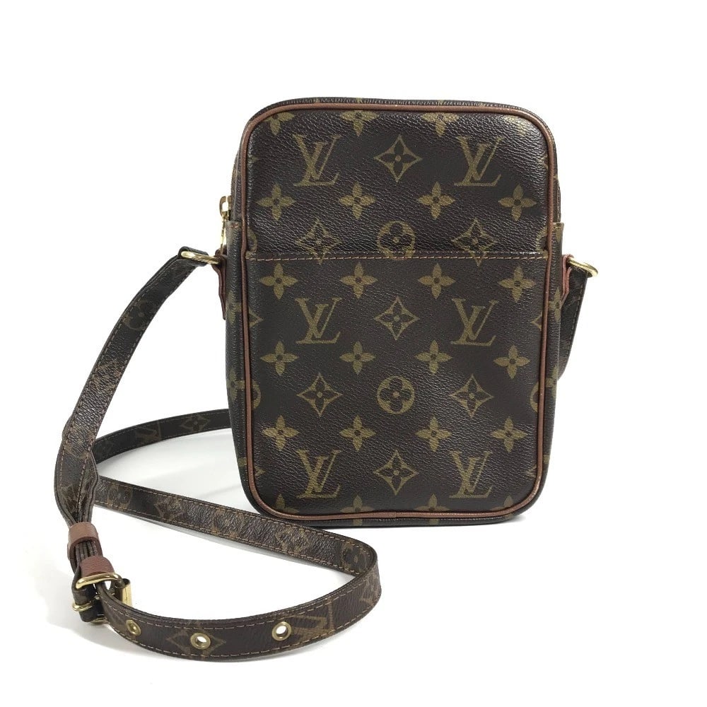LOUIS VUITTON COMME DES GARCONS PETIT POCHETTE SHOULDER BAG: LOUIS VUITTON Comme des Garcons Petit Pochette Shoulder Bag Brand: Louis Vuitton Type/Style: Shoulder Bag Material: MonogramCanvas Color: Brown Size: W5.7xH8.1xD2.0inch / W14.5cmxH20.5cmxD5cm Acce