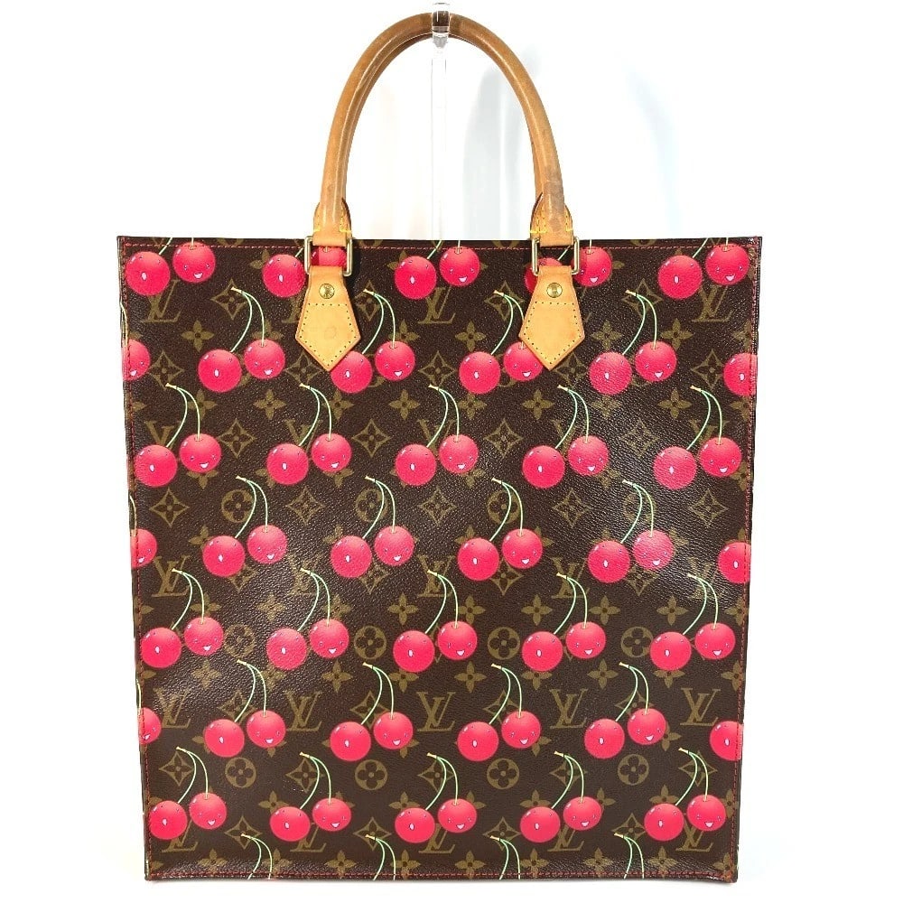 LOUIS VUITTON MONOGRAM CHERRY SAC PLAT TOTE BAG: LOUIS VUITTON Monogram Cherry Sac Plat Tote Bag Brand: Louis Vuitton Type/Style: Shoulder Bag Material: Monogram Canvas Color: Brown/Red Size: W14.0xH15.0xD3.5inch / W35.5cmxH38cmxD9cm Accessories
