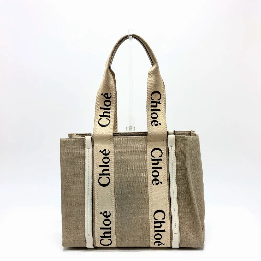 CHLOE LOGO WOODY MEDIUM HAND BAG TOTE BAG: Chloe logo Woody Medium Hand Bag Tote Bag Brand: Chloe Type/Style: Tote Bag Material: Canvas Color: Beige Size: W13.6xH11.0xD4.3inch / W34.5cmxH28cmxD11cm Accessories: None Accessories Notice: When
