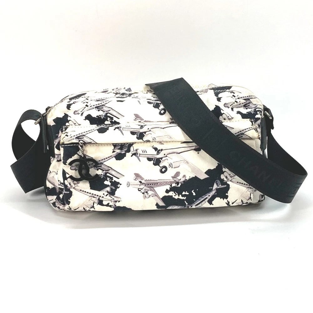 CHANEL AIRLINE BAG CROSSBODY POCHETTE SHOULDER BAG: CHANEL Airline Bag Crossbody Pochette Shoulder Bag Brand: CHANEL Type/Style: Shoulder Bag Material: Canvas Color: BlackxWhite Size: W9.6xH5.1xD3.9inch / W24.5cmxH13cmxD10cm Accessories: None