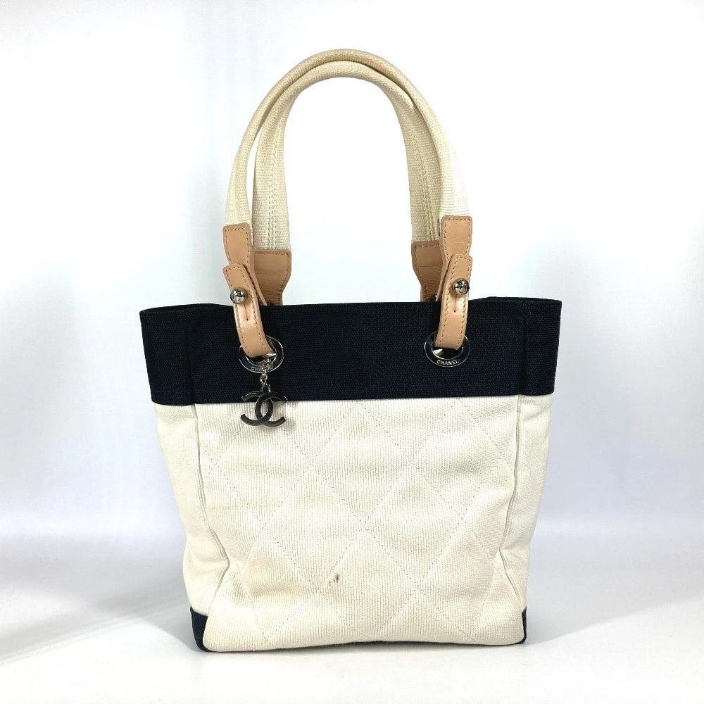 CHANEL CC MARK PARIS BIARRITZ PM TOTE BAG: CHANEL CC Mark Paris Biarritz PM Tote Bag Brand: CHANEL Type/Style: Shoulder Bag Material: Canvas Color: white x Black Size: W9.8xH10.6xD3.9inch / W25cmxH27cmxD10cm Accessories: None Acces