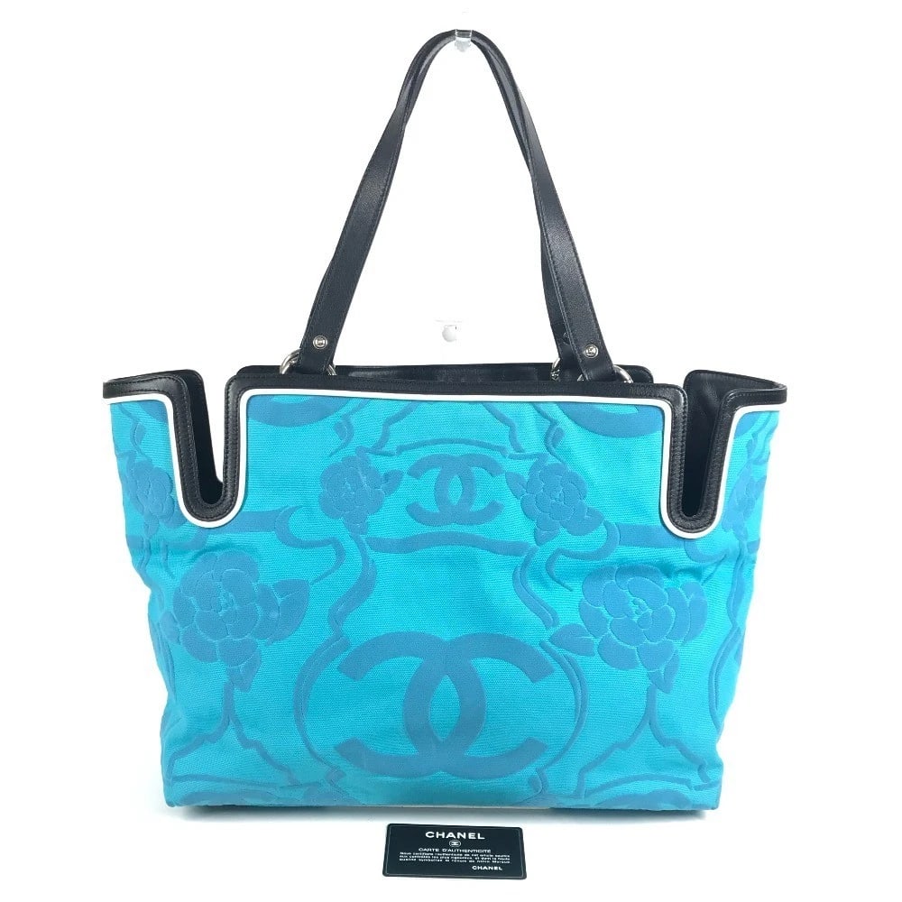 CHANEL LOGO CC CC MARK CAMELLIA TOTE BAG: CHANEL Logo CC CC Mark Camellia Tote Bag Brand: CHANEL Type/Style: Shoulder Bag Material: Leather/Canvas Color: Blue/ Black Size: W13.4xH11.0xD4.7inch / W34cmxH28cmxD12cm Accessories: None