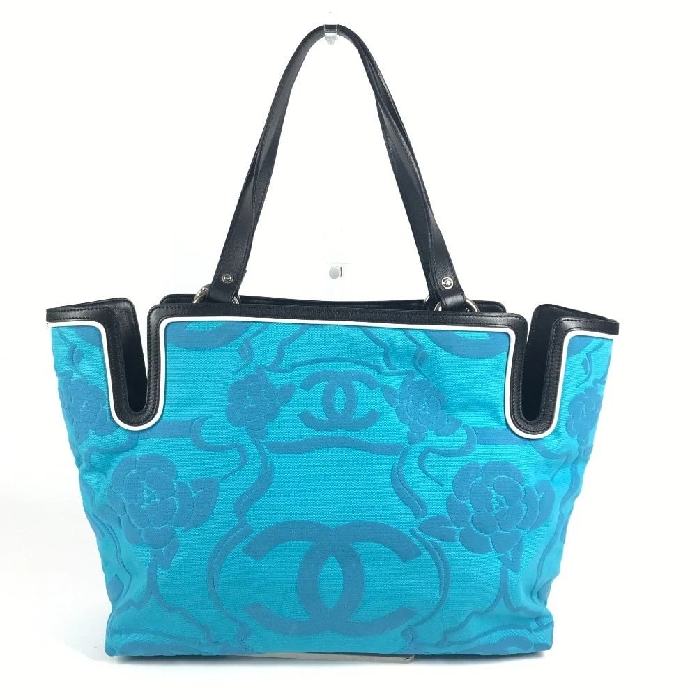 CHANEL LOGO CC CC MARK CAMELLIA TOTE BAG: CHANEL Logo CC CC Mark Camellia Tote Bag Brand: CHANEL Type/Style: Shoulder Bag Material: Leather/Canvas Color: Blue/ Black Size: W13.4xH11.0xD4.7inch / W34cmxH28cmxD12cm Accessories: None