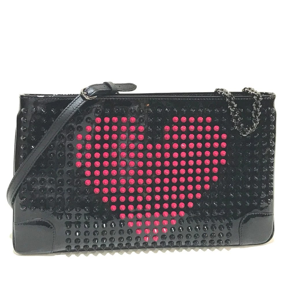 CHRISTIAN VALENTINE SPIKE STUDS CLUTCH BAG: CHRISTIAN Valentine Spike Studs Clutch Bag Brand: Christian Louboutin Type/Style: Clutch bag Material: Patent Leather Color: BlackxFuchsia Size: W12.1xH7.1inch / W30.8cmxH18cm Accessories: None