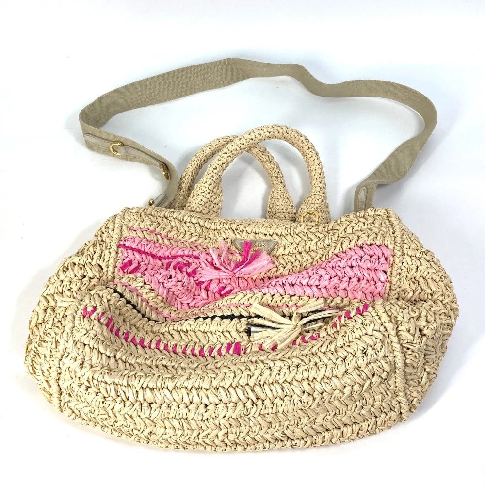 PRADA TRIANGLE LOGO PLATE CANAPA 2WAY SHOULDER BAG: PRADA triangle logo plate Canapa 2WAY Shoulder Bag Brand: PRADA Type/Style: Hand Bag Material: Raffia Color: Beige x pink Size: W11.4xH6.5xD4.7inch / W29cmxH16.5cmxD12cm Accessories: None
