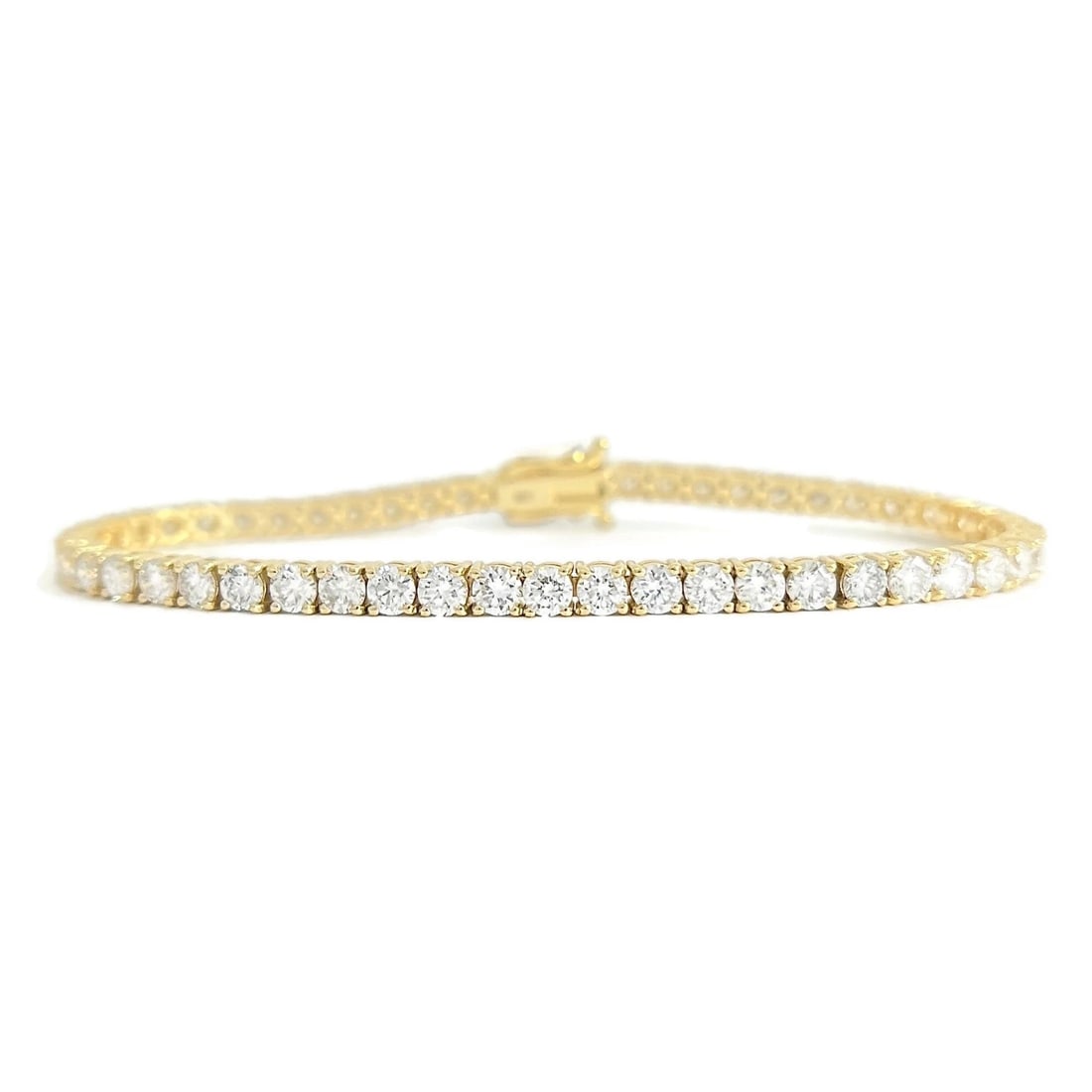 ROUND LAB-CREATED DIAMOND TENNIS BRACELET 14K YELLOW GOLD: Round Lab-Created Diamond Tennis Bracelet 14K Yellow Gold Brand: Unbranded Type/Style: Bracelet Material: 14K Yellow Gold, Main Stone Lab-Created Color: Gold Size: Length: 7 inches Width: 3.4 mm A