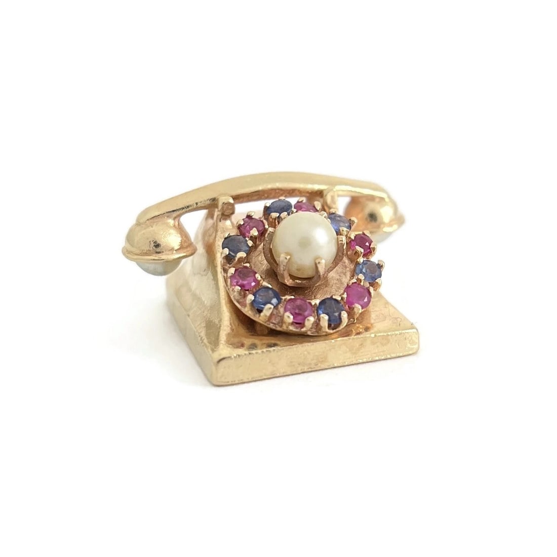 PEARL RUBY SAPPHIRE TELEPHONE CHARM 14K YELLOW GOLD: Pearl Ruby Sapphire Telephone Charm 14K Yellow Gold Brand: Estate Type/Style: Charm Material: 14K Yellow Gold, Main Stone Cultured Color: Gold Size: Measurements: 1 inch x 1 inch Accessories: None
