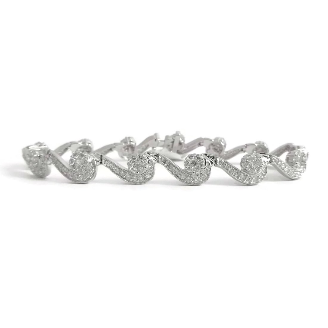 DIAMOND WAVE SCALLOPED TENNIS BRACELET 14K WHITE GOLD: Diamond Wave Scalloped Tennis Bracelet 14K White Gold Brand: Unbranded Type/Style: Bracelet Material: 14K White Gold, Main Stone Natural Color: Silver Size: Length: 7 inches Width: 7.7 mm Accessor