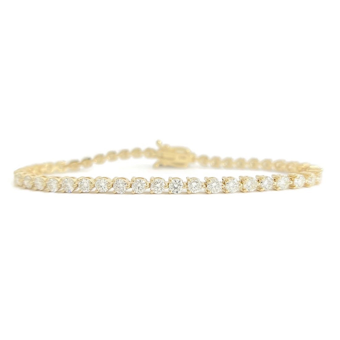 ROUND 3-PRONG DIAMOND TENNIS BRACELET 14K YELLOW GOLD: Round 3-Prong Diamond Tennis Bracelet 14K Yellow Gold Brand: Unbranded Type/Style: Bracelet Material: 14K Yellow Gold, Main Stone Natural Color: Gold Size: Length: 7 inchesWidth: 3.2 mm Accessorie