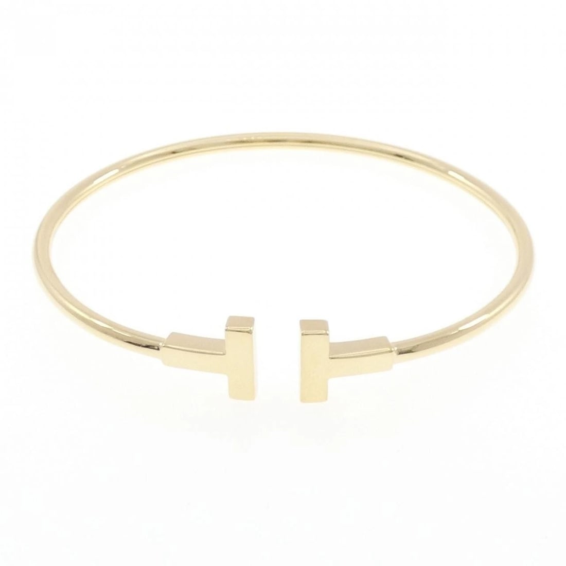 TIFFANY & CO. T-WIRE BANGLE: TIFFANY & Co. T-Wire Bangle Brand: TIFFANY&Co. Type/Style: TIFFANY & Co. Bracelet Material: 750 yellow gold, Color: yellow gold Size: 16cm Max width approx: 9.6mm Accessories: None Accesso