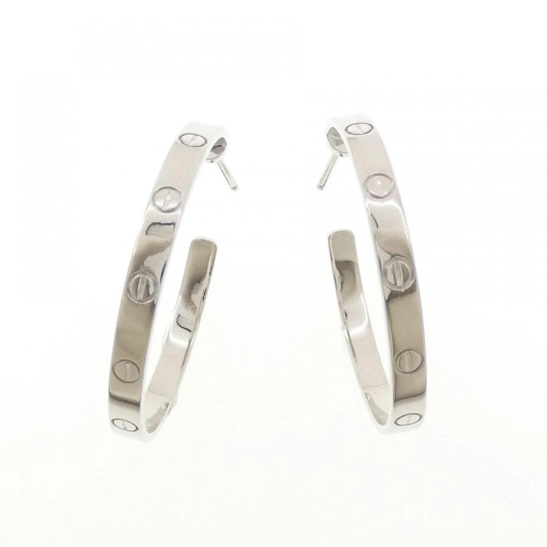 CARTIER LOVE PIERCE: Cartier Love Pierce Brand: CARTIER Type/Style: Cartier Pierce/Earring Material: 750 white gold, Color: white gold Size: Approximate dimensions (height x width): 34.9mm x 3.5mm Accessories: None
