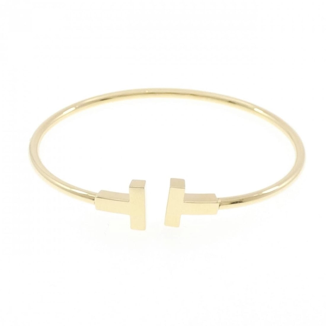 TIFFANY & CO. T-WIRE BANGLE: TIFFANY & Co. T-Wire Bangle Brand: TIFFANY&Co. Type/Style: TIFFANY & Co. Bracelet Material: 750 yellow gold, Color: yellow gold Size: 16cm Max width approx: 9.6mm Accessories: None Accessories