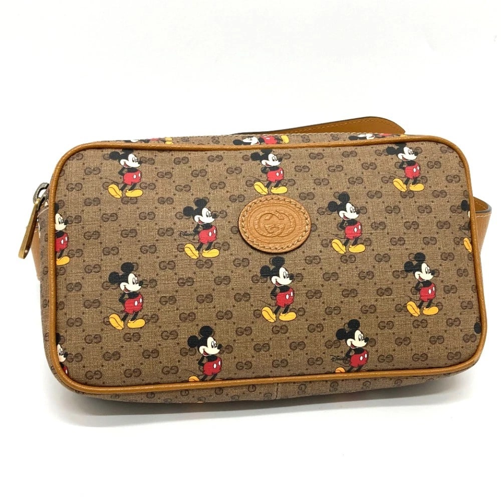 GUCCI DISNEY COLLAB MINI GG SUPREME BELT BAG BODY BAG: GUCCI Disney Collab Mini GG Supreme Belt bag body bag Brand: GUCCI Type/Style: body bag Material: GG supreme Canvas Color: Brown Size: W9.3xH5.3xD1.9inch / W23.6cmxH13.5cmxD4.8cm Accessories: None