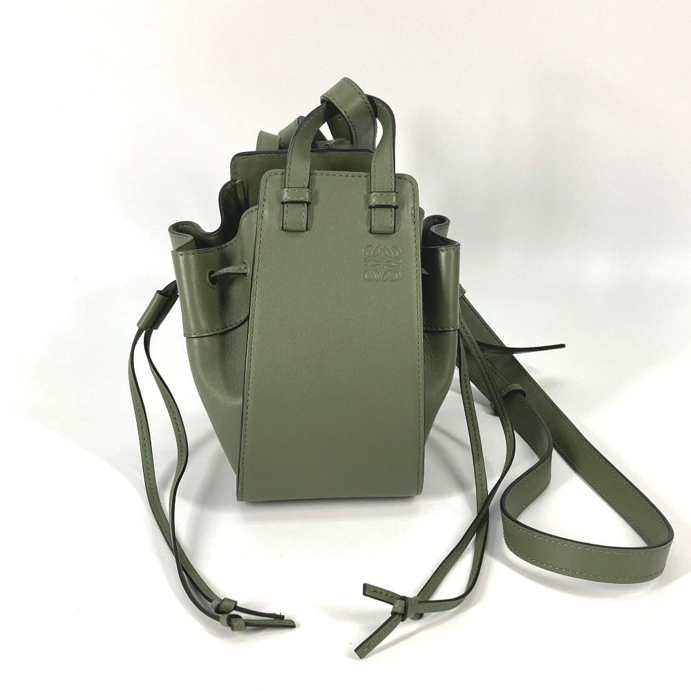 LOEWE SHOULDER CROSSBODY MINI HAMMOCK DRAWSTRING HAND BAG: LOEWE Shoulder Crossbody mini hammock drawstring Hand Bag Brand: LOEWE Type/Style: Shoulder Bag Material: Leather Color: Khakhi / tan Size: W4.1xH7.5xD5.5inch / W10.5cmxH19cmxD14cm Accessories: No