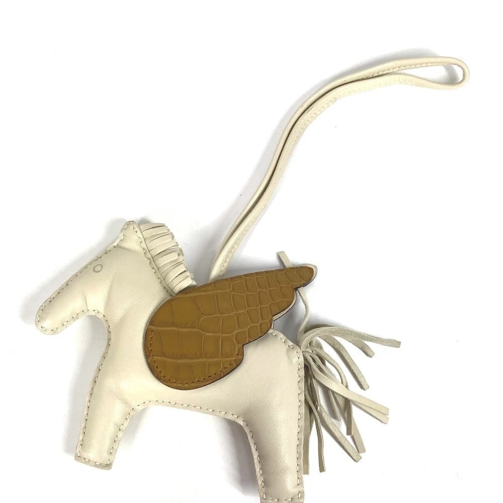 HERMES RODEO PEGASUS TOUCH MM BAG CHARM: HERMES Rodeo Pegasus Touch MM Bag charm Brand: HERMES Type/Style: charm Material: Anyo Miro Color: WhiteBasedxBrown Size: Total Length: 10.0inch / 25.5cm Accessories: None Accessories Notice: When