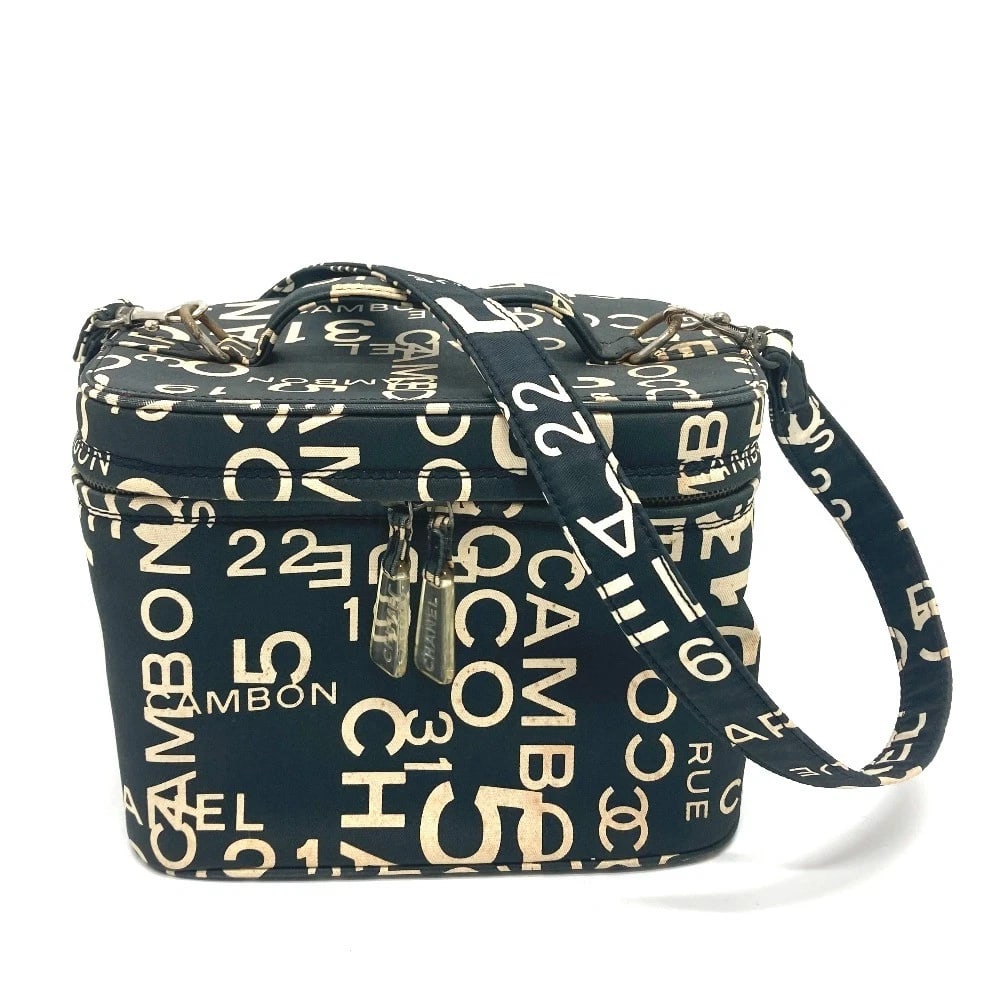 CHANEL BY THE SEA LINE LOGO VANITY BAG COSMETIC BAG: CHANEL By The Sea Line logo Vanity bag Cosmetic bag Brand: CHANEL Type/Style: Hand Bag Material: Cotton Canvas Color: Black Size: W9.4xH7.1xD6.1inch / W24cmxH18cmxD15.5cm Handle: 6.3inch / 16cm Ac