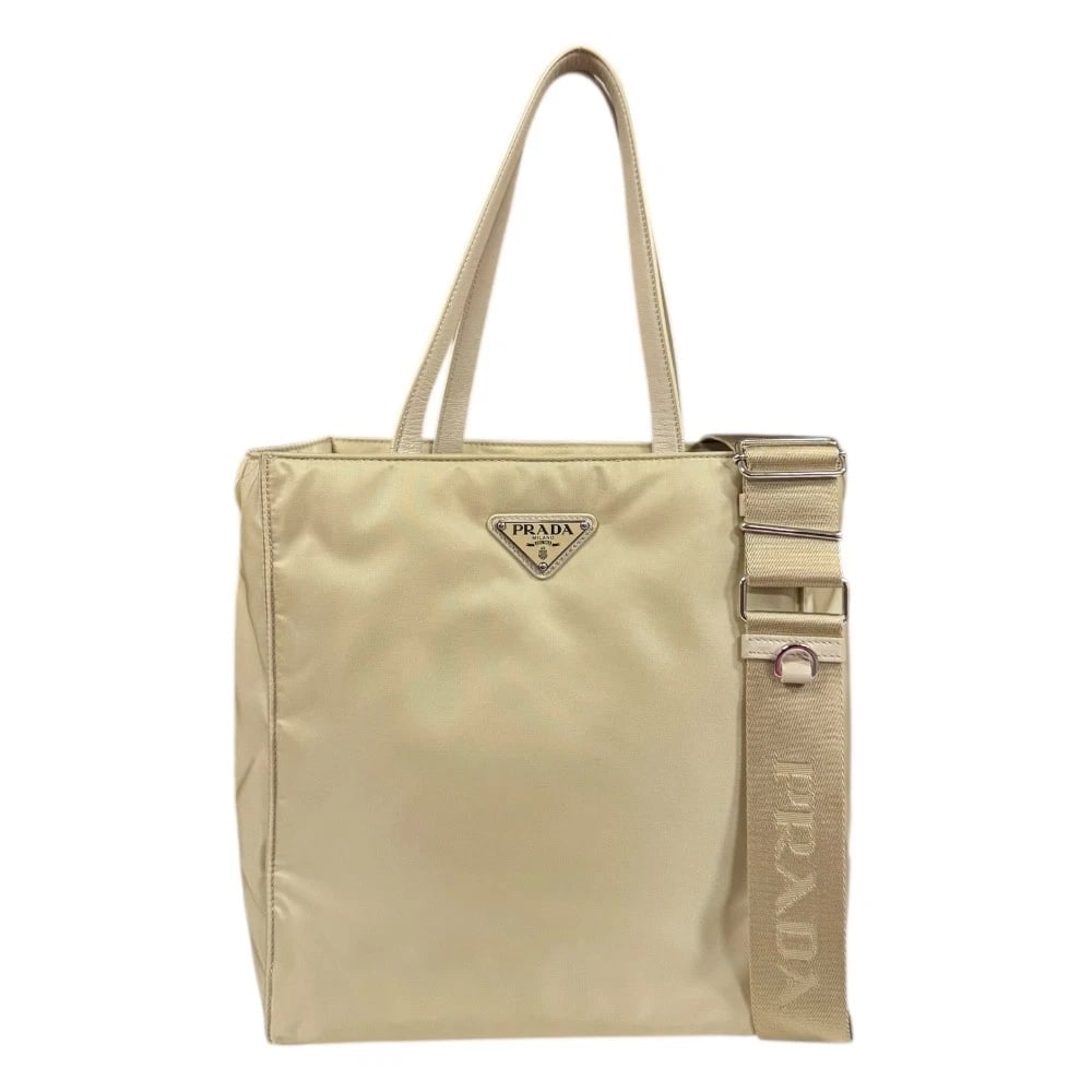 PRADA SHOULDER BAG CROSS BODY: PRADA Shoulder Bag Cross Body Brand: PRADA Type/Style: Shoulder Bag Material: Exterior Material Renylon Color: Exterior color beige Size: W9.4 x H10.2 x D4.9inch Handle:15.9inch Accessories: None