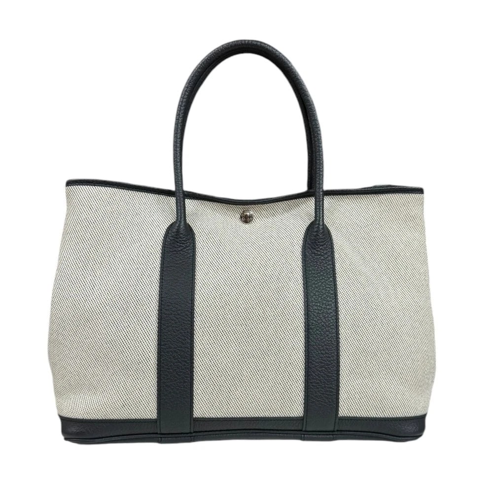 HERMES HANDBAG LEATHER CANVAS GARDEN PARTY PM: HERMES Handbag leather canvas Garden party PM Brand: HERMES Type/Style: Handbag Material: Exterior Material leather Color: Exterior color white Size: W14.2 x H10.2 x D6.7inch Handle:15.7inch Acces