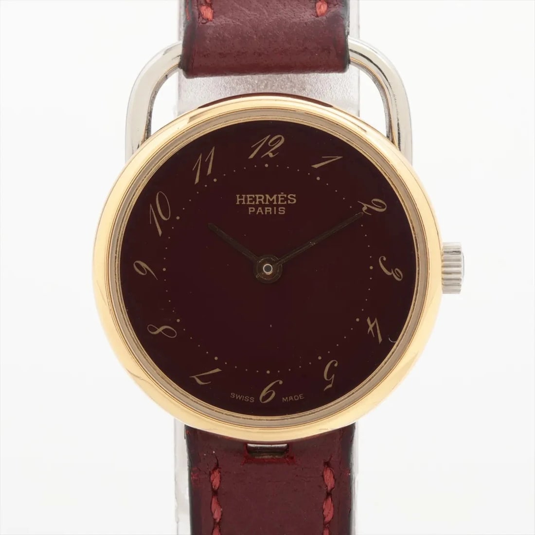 HERMES ALSAU GP?SS & LEATHER QZ BORDEAUX DIAL WATCH: Hermes Alsau Gp?Ss & Leather Qz Bordeaux Dial Watch Brand: Hermes Type/Style: Wristwatch Material: GP x SS x leather Color: Dial Color Bordeaux Size: Case:W0.8 x H0.8inch / W25 x H25 Circumference of
