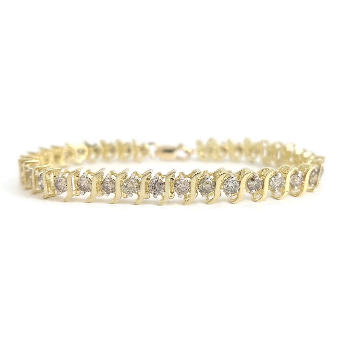 CHAMPAGNE DIAMOND S-LINK TENNIS BRACELET 10K YELLOW GOLD: Champagne Diamond S-Link Tennis Bracelet 10K Yellow Gold Brand: Estate Type/Style: Bracelet Material: 10K Yellow Gold, Main Stone Natural Color: Gold Size: Length: 7.5 inches Width: 7 mm Accessori