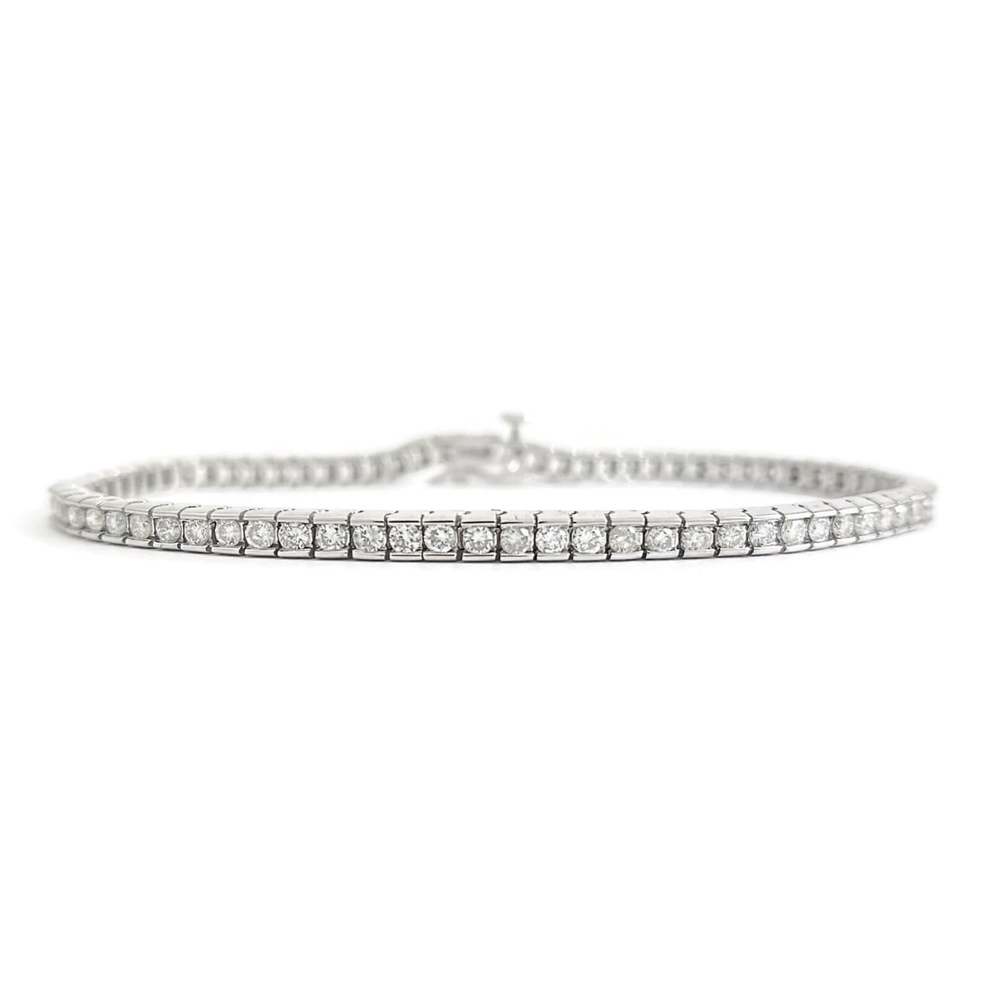 CHANNEL-SET DIAMOND TENNIS BRACELET 14K WHITE GOLD: Channel-Set Diamond Tennis Bracelet 14K White Gold Brand: Unbranded Type/Style: Bracelet Material: 14K White Gold, Main Stone Natural Color: Silver Size: Length: 7.5 inchesWidth: 3.4 mm Accessorie