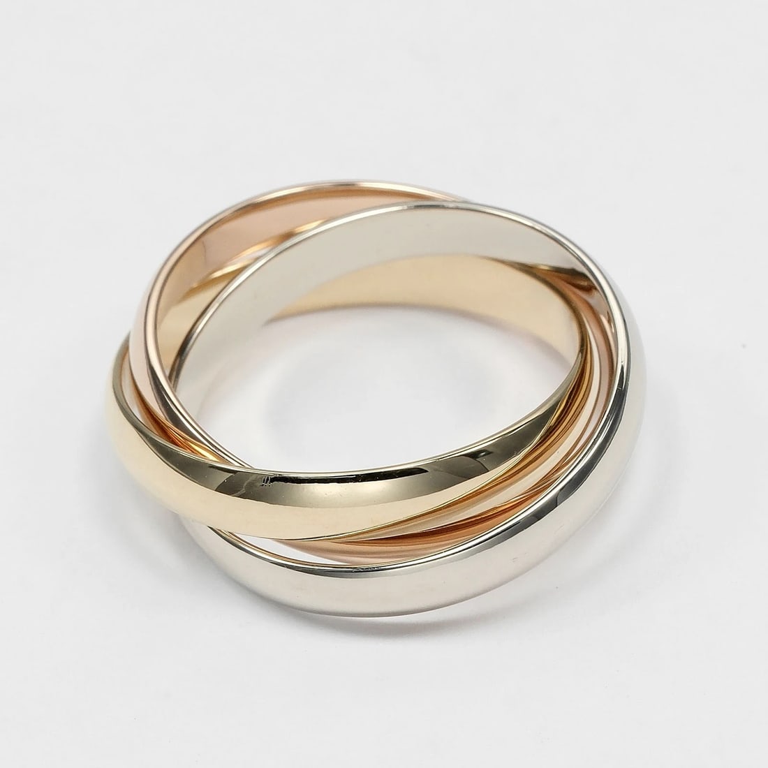 CARTIER TRINITY RING BAND K18 GOLD: CARTIER Trinity Ring band K18 Gold Brand: CARTIER Type/Style: Ring Material: K18 Gold (YGxPGxWG), Color: YGxPGxWG Size: 7.4(US Size) Accessories: None Accessories Notice: When purchasing pre-owned