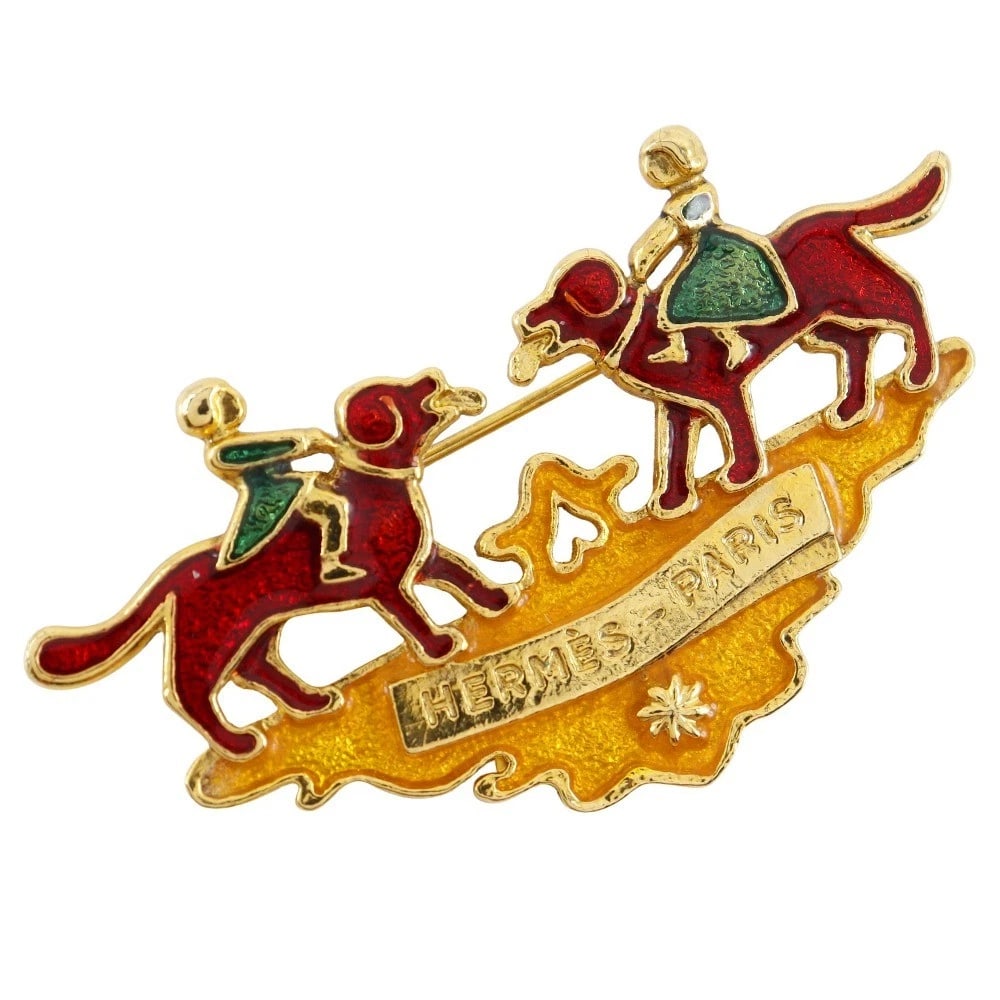 HERMES CLOISONNE GIRL & DOG BROOCH: HERMES Cloisonne Girl & Dog Brooch Brand: HERMES Type/Style: Brooch Material: Plated Gold, Color: None Size: Size(CM) 3.8mm x 6.3mm Accessories: None Accessories Notice: When purchasing pre-owned