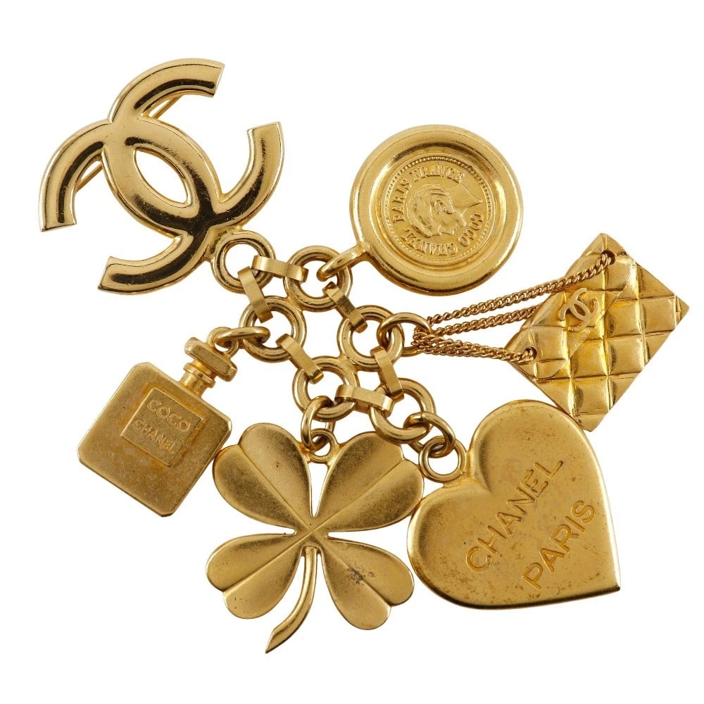 CHANEL ICON CHARM BROOCH: CHANEL Icon charm Brooch Brand: CHANEL Type/Style: Brooch Material: Plated Gold, Color: Gold Size: Size(CM) 105mm x 80mm Accessories: None Accessories Notice: When purchasing pre-owned goods, please