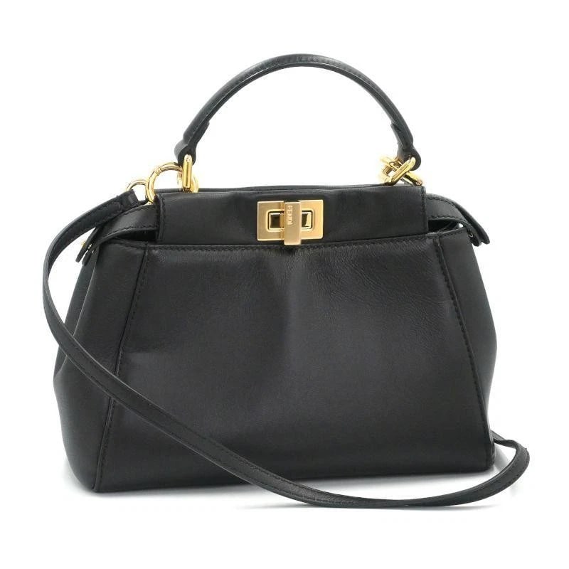 FENDI BAG: MINI PEEKABOO BLACK: FENDI Bag: Mini Peekaboo Black Brand: FENDI Type/Style: Top Handle Bag Material: Exterior Material Leather Color: Exterior Color Black Size: (approx. W9.1 ? H7.1 ? D4.3 inch) Accessories: None