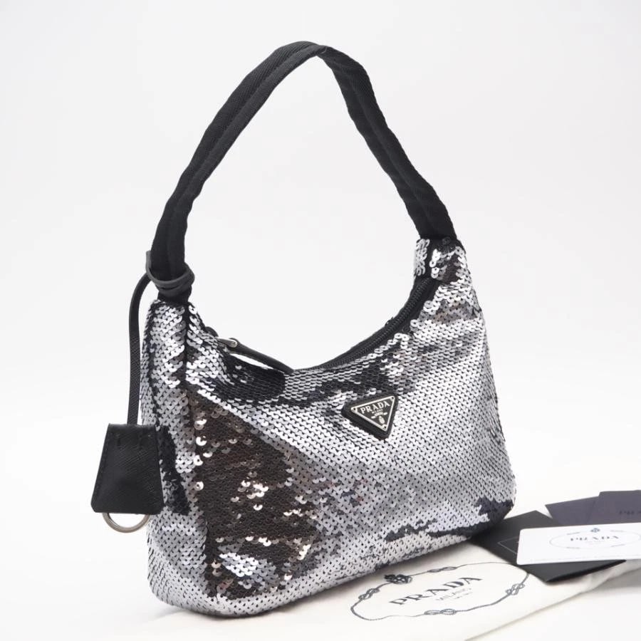 PRADA BAG: RE-EDITION SEQUIN HOBO SILVER BLACK: PRADA Bag: Re-Edition Sequin Hobo Silver Black Brand: PRADA Type/Style: Shoulder Bag Material: Exterior Material Nylon / Sequin Color: Exterior Color Silver / Black Size: (approx. W9.1 ? H5.1 ? D2.4 i