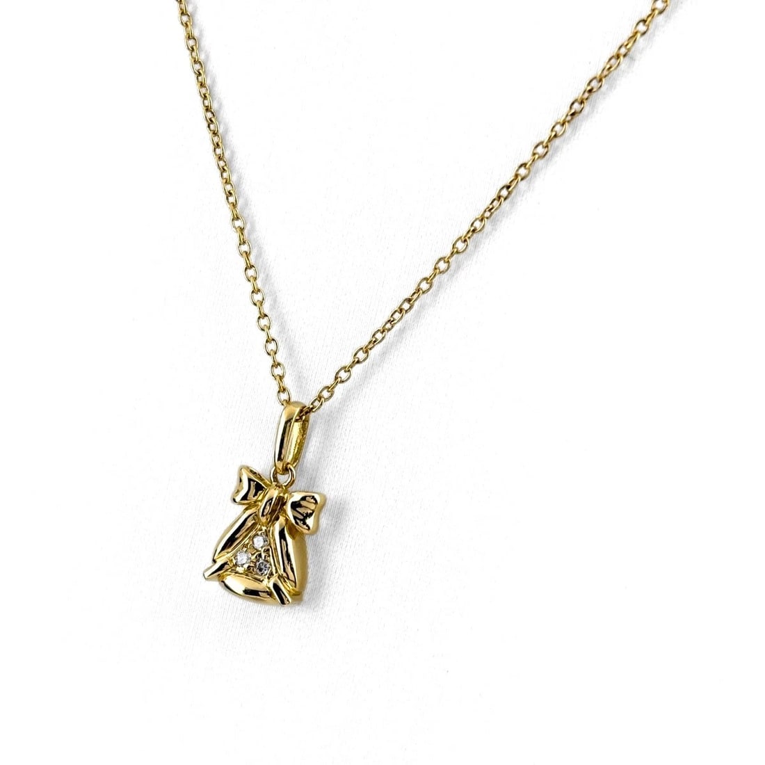 CHRISTIAN DIOR RIBBON MOTIF YG PENDANT MELEE DIAMOND NECKLACE: Christian Dior Ribbon Motif Yg Pendant Melee Diamond Necklace Brand: Christian Dior Type/Style: Necklace Material: 750 YG, Main Stone Natural Color: YG Size: 15.4x7.5mm(0.6") Accessories: None