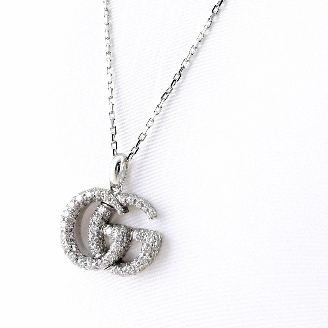 GUCCI GG RUNNING NECKLACE PENDANT MELEE DIAMOND: Gucci Gg Running Necklace Pendant Melee Diamond Brand: GUCCI Type/Style: Necklace Material: 750, Main Stone Natural Color: None Size: 21.1x18.3mm(0.8") Accessories: None Accessories Notice: When