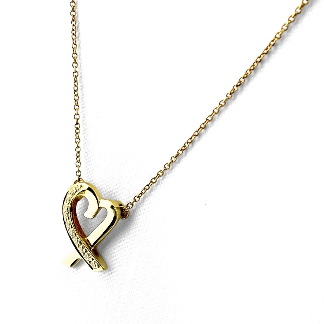 TIFFANY&CO. RUBBING HEART NECKLACE YG PENDANT DIAMOND: Tiffany&Co. Rubbing Heart Necklace Yg Pendant Diamond Brand: TIFFANY&Co. Type/Style: Necklace Material: 750YG, Main Stone None Color: YG Size: 15.1x11.4mm(0.6") Accessories: None Accessories Notice:
