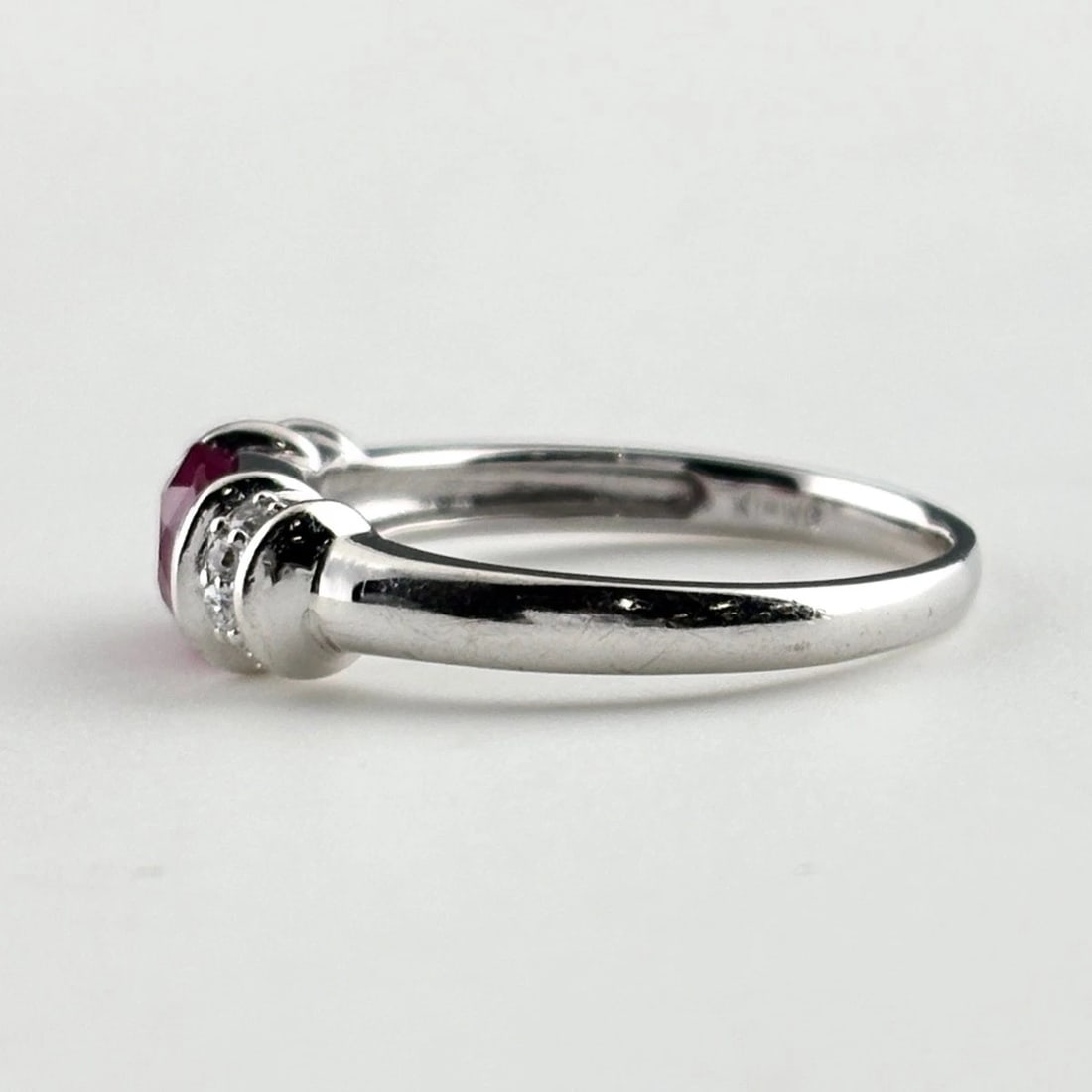 RUBY DESIGN RING WG MELEE DIAMOND RING: Ruby Design Ring Wg Melee Diamond Ring Brand: Unbranded Type/Style: Ring Material: 18K WG, Main Stone Ruby /Secondary Stone:Natural Color: WG Size: US7 to 7.5 Accessories: None Accessories