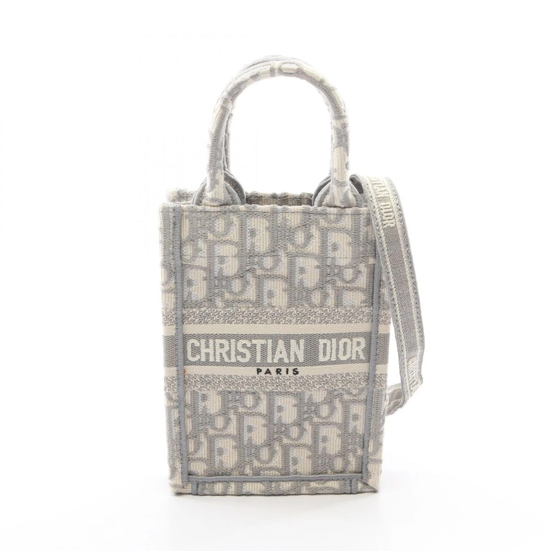 DIOR BOOK TOTE VERTICAL MINI PHONE SHOULDER HANDBAG: Dior BOOK TOTE Vertical Mini Phone Shoulder Handbag Brand: DIOR Type/Style: Handbag Material: canvas Color: Gray?ish colors ? White?ish colors Size: (H:7.1inch x W:5.1inch x D:2.0inch) Accessories