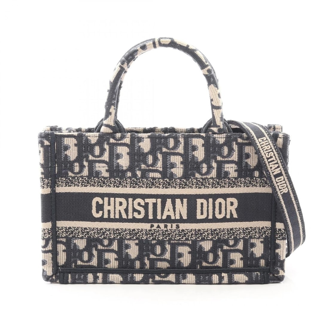 CHRISTIAN DIOR BOOK TOTE MINI TOTE BAG: Christian Dior BOOK TOTE Mini Tote Bag Brand: CHRISTIAN DIOR Type/Style: Tote Bag Material: Beige?ish colors ? Navy?ish colors Color: canvas Size: (H:5.1inch x W:8.3inch x D:3.1inch) Accessories: