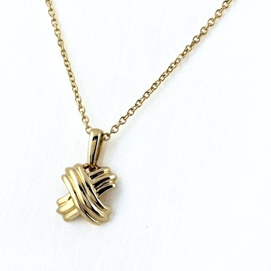 TIFFANY&CO. CROSS STITCH NECKLACE YG PENDANT 750: Tiffany&Co. Cross Stitch Necklace Yg Pendant 750 Brand: TIFFANY&Co. Type/Style: Necklace Material: 750YG, Main Stone None Color: YG Size: 13.2x7.9mm(0.5") Accessories: None Accessories Notice: When