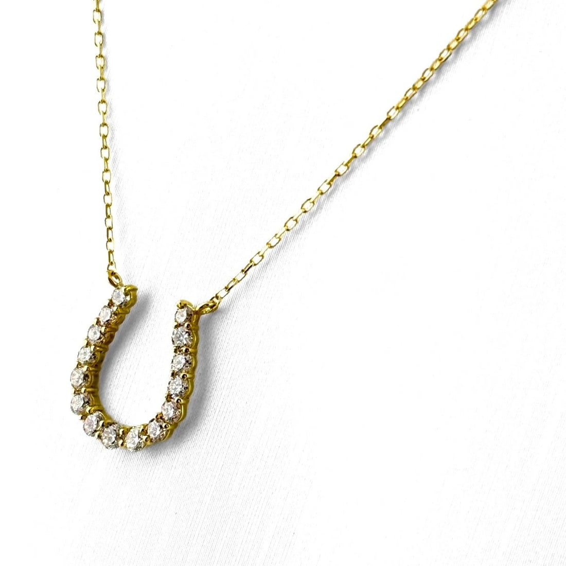 MELEE DIAMOND YG PENDANT HORSESHOE NECKLACE: Melee Diamond Yg Pendant Horseshoe Necklace Brand: Unbranded Type/Style: Necklace Material: 18K YG, Main Stone Natural Color: YG Size: 13.3x11.5mm(0.5") Accessories: None Accessories Notice: When