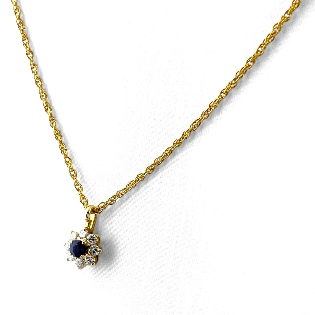 SAPPHIRE YG PENDANT MELEE DIAMOND NECKLACE: Sapphire Yg Pendant Melee Diamond Necklace Brand: Unbranded Type/Style: Necklace Material: 18K YG, Main Stone Sapphire /Secondary Stone:Natural Color: YG Size: 11.4x7.5mm(0.4") Accessories: None