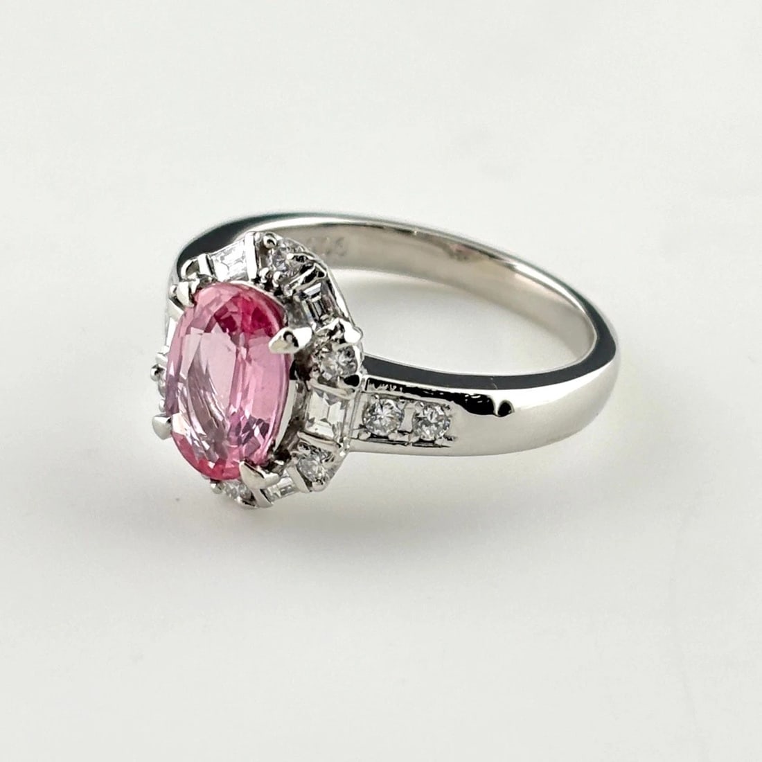 PADPARADSCHA SAPPHIRE DESIGN RING PLATINUM MELEE DIAMOND RING: Padparadscha Sapphire Design Ring Platinum Melee Diamond Ring Brand: Unbranded Type/Style: Ring Material: Pt900, Main Stone Sapphire /Secondary Stone:Natural Color: None Size: US5.5 to 6 Accessories: