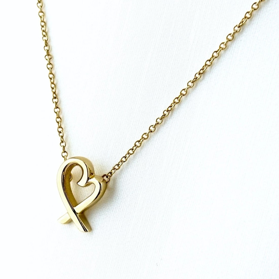 TIFFANY&CO. RUBBING HEART NECKLACE YG PENDANT NECKLACE: Tiffany&Co. Rubbing Heart Necklace Yg Pendant Necklace Brand: TIFFANY&Co. Type/Style: Necklace Material: 750YG, Main Stone Ruby /Secondary Stone:Natural Color: YG Size: 11.6x8.6mm(0.5") Accessories: