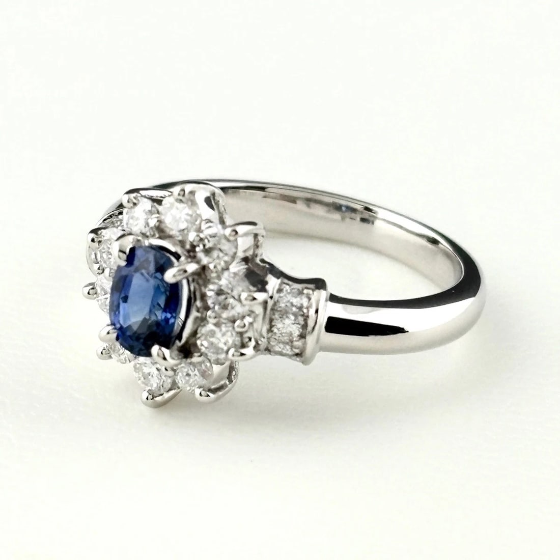 SAPPHIRE DESIGN RING PLATINUM MELEE DIAMOND RING: Sapphire Design Ring Platinum Melee Diamond Ring Brand: Unbranded Type/Style: Ring Material: Pt900, Main Stone Sapphire /Secondary Stone:Natural Color: None Size: US5.5 to 6 Accessories: None